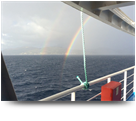 Rainbows diving into the sea Kefalonia - Greece